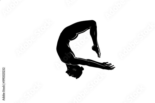 Graceful Pose: The silhouette of a gymnast performing a backbend, showcasing the beauty of the human form in a moment of athletic grace.