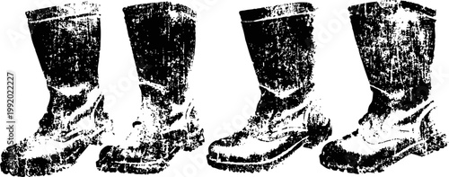 worn leather boots in a row with distressed vintage texture and rough sole design