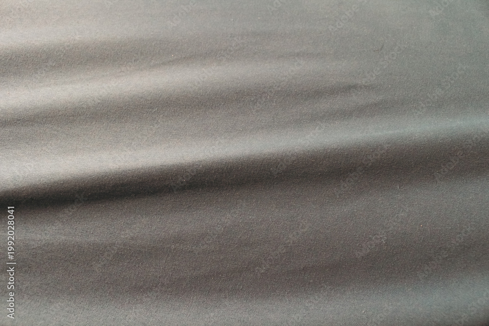 Obraz premium Smooth Gray Satin Fabric Texture with Elegant Flowing Folds, Luxury Silk Cloth Background