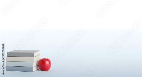 Stack of books and apple