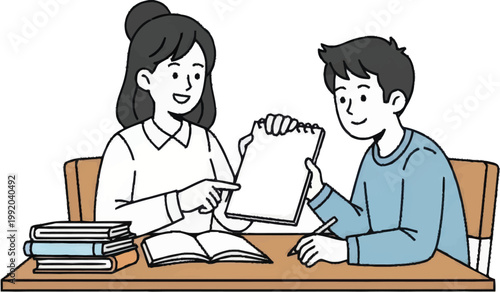 Two students studying together at desk.