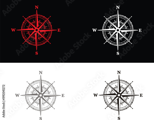 Four different colored compass rose navigation symbols