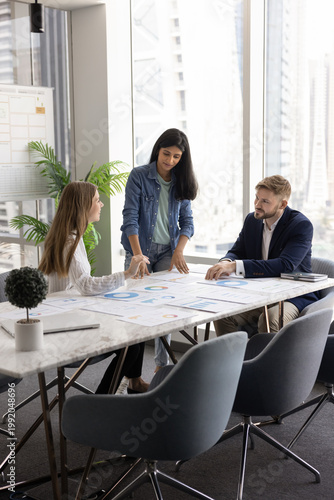 Canvas Print Group of professional marketing analysts reviewing campaign metrics and performa