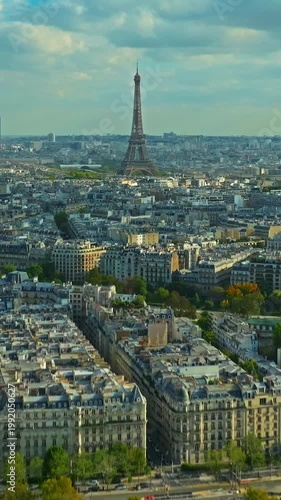 Aerial panning view of the historic center of Paris with the Eiffel Tower at summer day. Panorama of Paris from above. Aerial View on Eiffel Tower and Champ de Mars