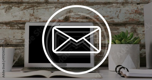 Vertical video: laptop getting email ping, envelope icon pulsing over screen, aiding business flow