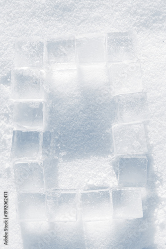 The border, made of ice cubes on a snowy surface.
