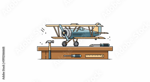 A model biplane sits on a workbench with tools like a hammer, screwdrivers, and a ruler