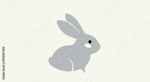 A minimalist gray rabbit with simple features sits on a pale yellow background