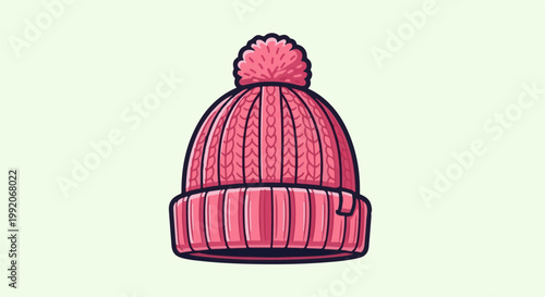 A knitted pink beanie with a fluffy pompom on top