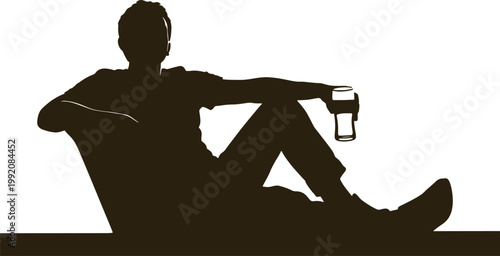 Silhouette of man relaxing on couch holding glass of drink, casual leisure and enjoyment.
