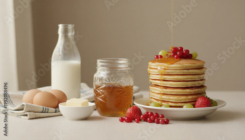 Breakfast ingredients with eggs milk butter and delicious pancakes