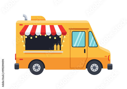 A food truck is parked on a street with a striped awning