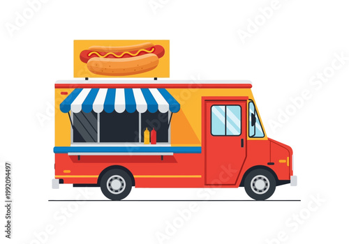 A colorful hot dog truck drives down a city street at daytime