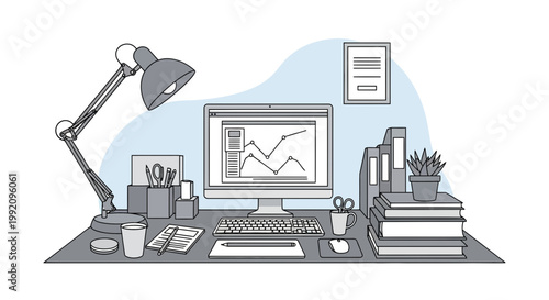 Workspace with computer, desk lamp, and office supplies showing graphs and charts in a modern setting