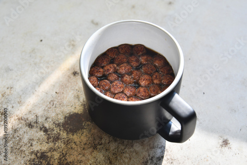 Coffee with chocolate chips on the table