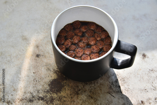 Coffee with chocolate chips on the table