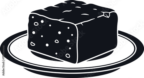 Single dark cube shaped food item on plate, food silhouette.