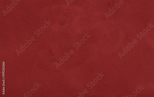 Deep red suede texture fills the frame