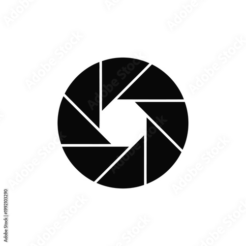 A black and white illustration of a camera aperture opening