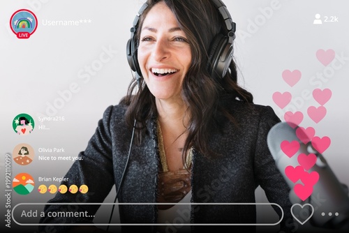 Fotografía Happy female radio host broadcasting live in a studio