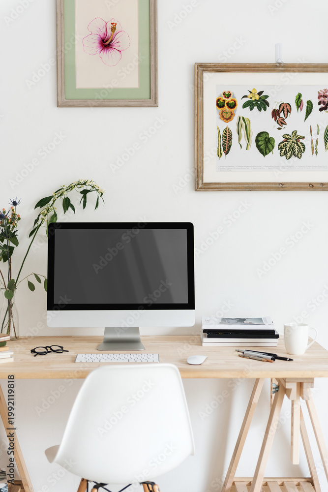 Fototapeta premium Minimalist workspace with botanical art, suitable as mockup
