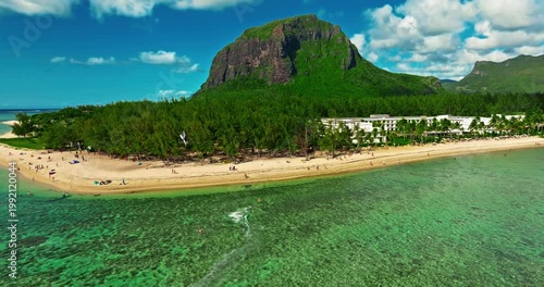 Aerial view of Le Morne beach in Mauritius, Le Morne Brabant mountain and luxury beachfront resort in the foreground
