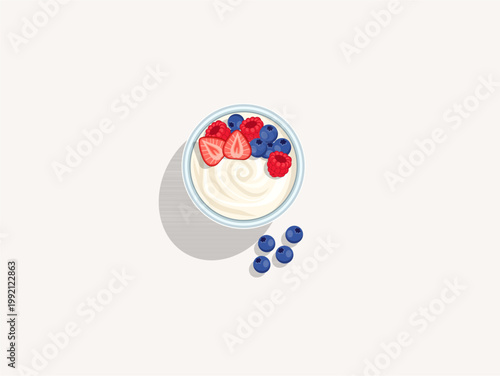 Creamy yogurt swirl bowl topped with fresh strawberry slices, blueberries and raspberries