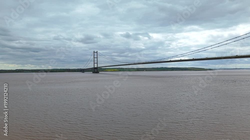 Drone perspective capturing the iconic Humber Bridge spanning muddy estuarine waters