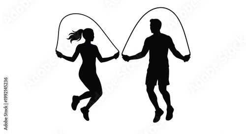 A couple joyfully jumping rope together a striking silhouette