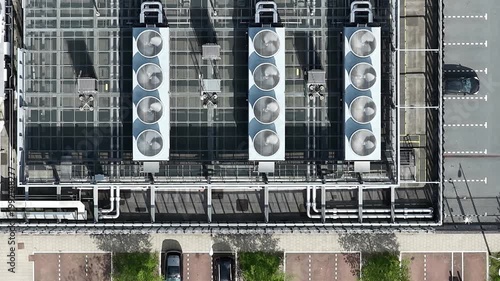 Aerial top down view of rooftop hvac system and parking lot
