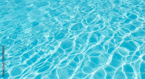 Refreshing Blue Swimming Pool Water Ripples and Sun Reflections