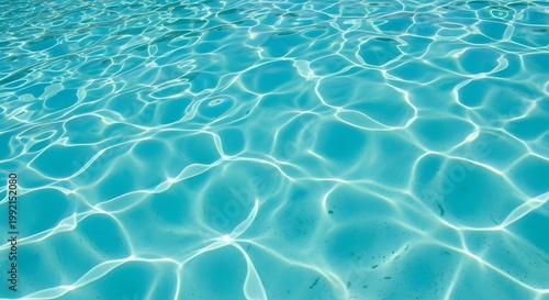 Rippling blue water surface with sunlight reflections