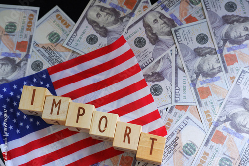 The IMPORT text with the US flag and dollar as the background. The concept of increasing import taxes and fees set by the US government