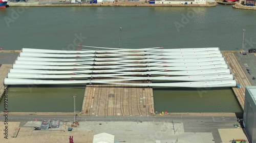 Aerial drone view of wind turbine blades laid out at a port facility in Hull UK