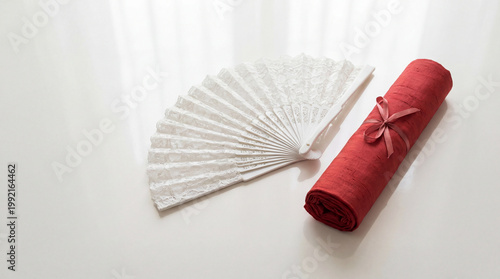 Elegant Japanese Fan and Red Scroll with Ribbon.