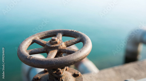 Close-up of an old industrial valve wheel.