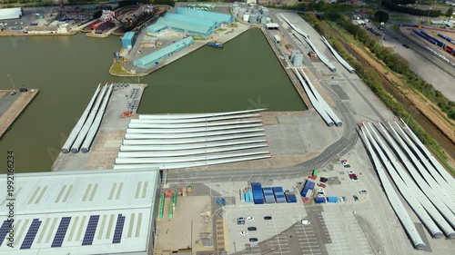 Aerial drone view of wind turbine blades laid out at a port facility in Hull UK