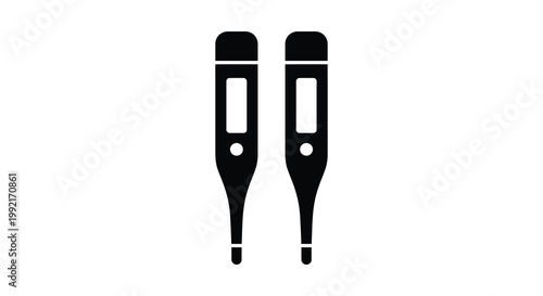 Two digital thermometers displayed side by side a stark black silhouette