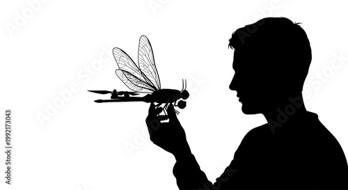Silhouette of a dragonfly shaped drone on white background for tech and robotics
