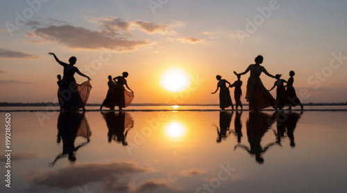 Silhouettes of dancers performing gracefully at sunset.