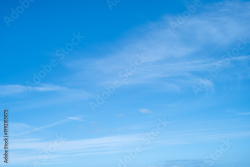 Photography Blue sky background with very light whisky clouds.