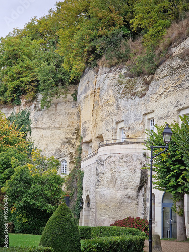 Rochecorbon, France - October 24, 2025: Les Hautes Roches troglodyte dwellings carved directly into a limestone cliff. Unique hotel with luxury rooms cut into the rocks
