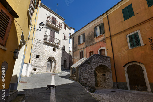 A street among old buildings in an old town in Molise, Italy.