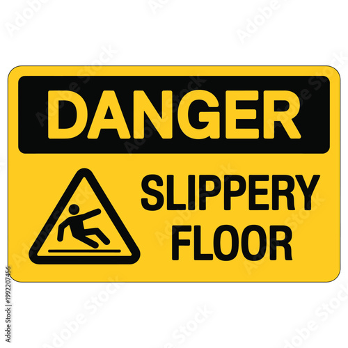 A bright yellow danger sign warns of a slippery floor with a graphic