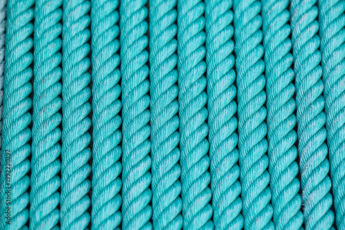 Aqua rope winding creating textured pattern background