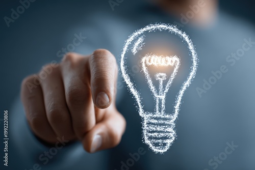 Male Hand Points To Glowing Light Bulb Idea Symbol Formed By Digital Particles Macro Shot