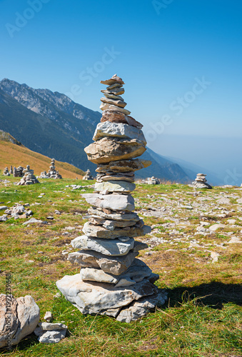 Fotografie big rock cairn of rough stones at Monte Baldo mountain, italy