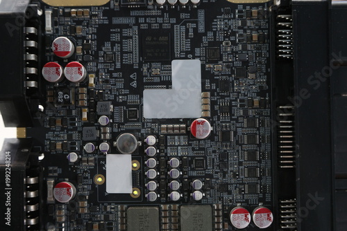 A black electronic board with a white label on it