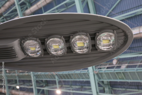 A street light with four lights on it.