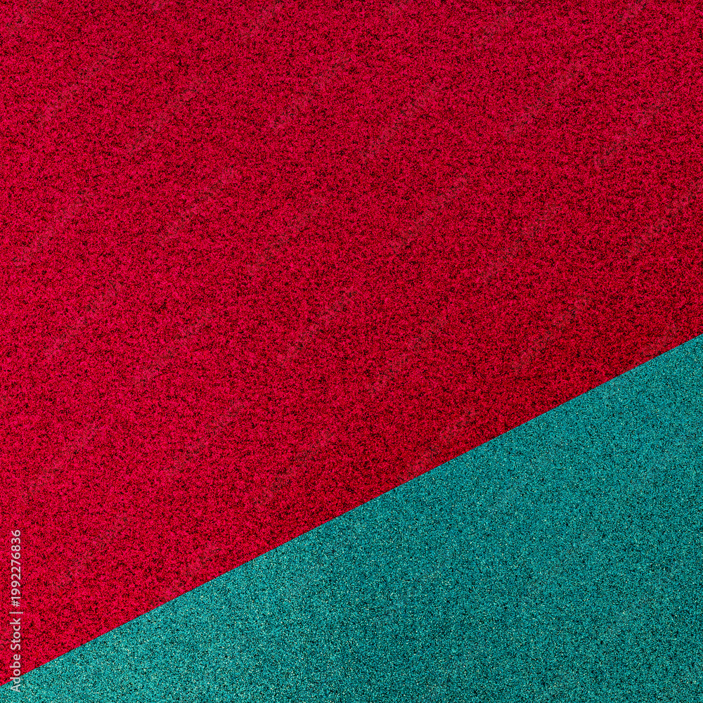 Fototapeta premium Colorful texture with red and green shades on a flat surface showing a split in colors during daylight